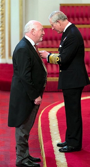 BOB HOLT receives the OBE from Prince Charles