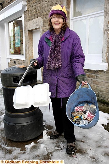 Volunteer Gillian Clark managed to pick up some litter in Delph village, wearing her royal paper grown