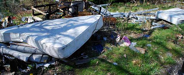 LOOK what's sprung up in Oldham... mattress and other rubbish is dumped