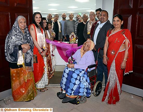 CUTTING the ribbon . . . 97 year old Radhabai Shivjibhai Gorasia opens the new extension