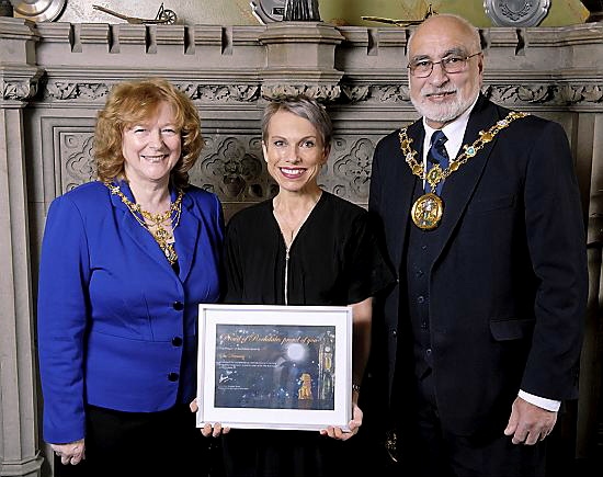 AWARD: Sue Devaney receives her award from the Mayoress of Rochdale, Councillor Cecile Biant, and the Mayor, Councillor Surinder Biant.