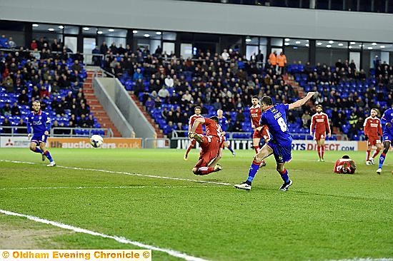 GOING FOR IT . . . Mike Jones has a strike at goal.