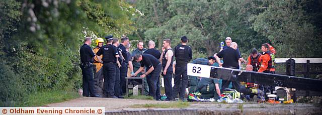 POLICE and search team members at the scene