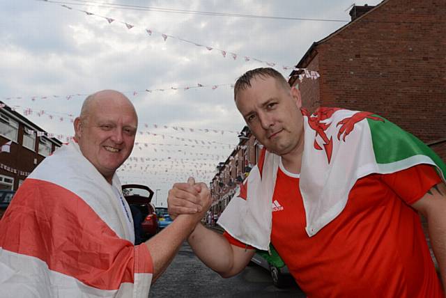 Friendly Euro 2016 rivalry on Wales Street, Watersheddings. From left Chris Farrand (England) Chris Cunningham (Wales) 