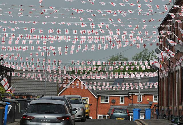 Wales Street off Ripponden Road. England and Wales fans put up flags and bunting and change the Wales Street sign to England Street.