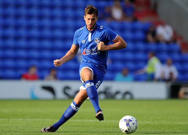 ATHLETIC new boy Ollie Banks plays a pass