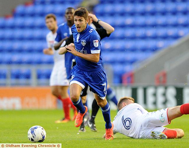 SKIPPING AWAY . . . Ryan Flynn gets past the challenge of Wigan midfielder Max Power