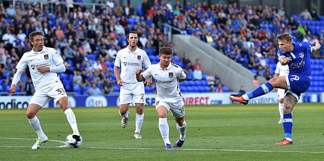 ON TARGET . . . Lee Erwin tries a long-range strike at the Northampton goal