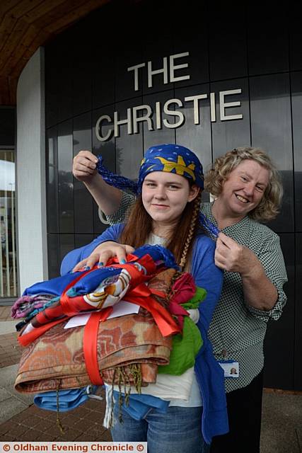 Karina Neufeldt (13) from China has launched a charity called Comfort for Cancer to supply free headscarves to cancer patients attending the Macmillan Information & Support Centre and Christie Hospital in Royal Oldham Hospital. Pictured here is Karina Neufeldt and Helen Murphy Macmillan Information & Support Centre manager.