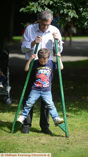 WALKING tall . . . Henry Maguire (4) with his grandfather John Maguire.