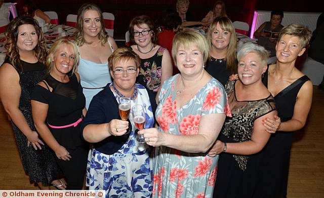 RAISING a glass . . .  Helen Haigh, centre left, and Maria Bramley, consultant, centre right, with the models