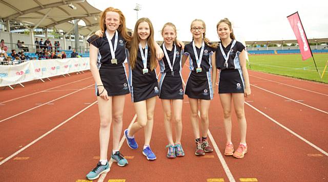 ON track . . . Saddleworth School pupils with their medals