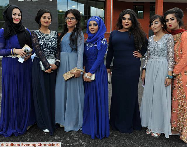 WE shall go to the ball . . .  the girls in their stunning frocks and gowns. 