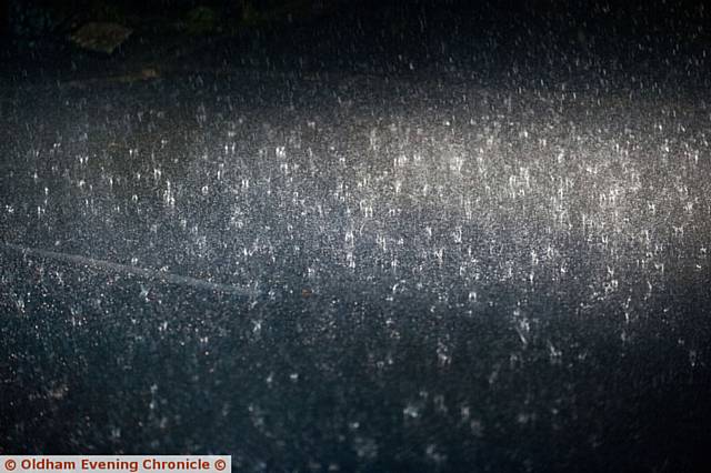 Thunderstorm hits Oldham and Saddleworth. PIC shows rain hitting the road.