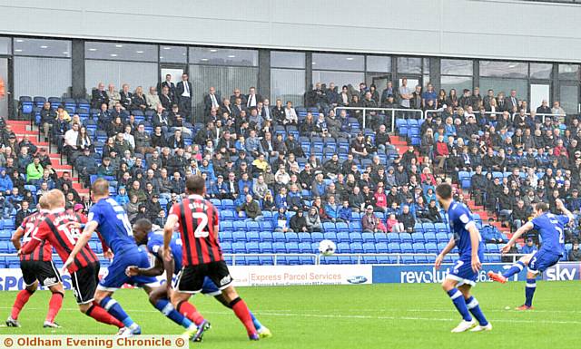 GRANDSTAND FINISH . . . full-back Josh Law puts Athletic ahead with a well-directed free-kick