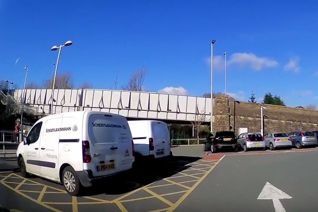 Contractor vans parked in the disabled bays at Derker Metrolink station