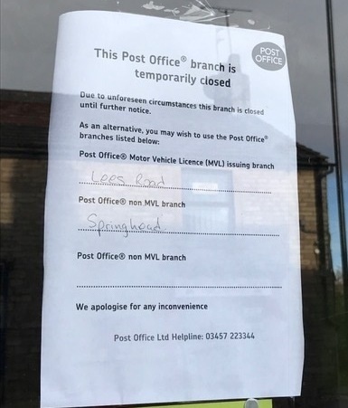 THE sign in the door at the post office