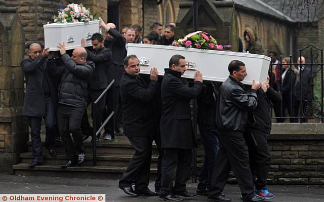 LAID to rest . . . the coffins leave church