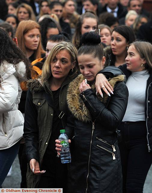 CAN'T hold back the tears . . . mourners gather