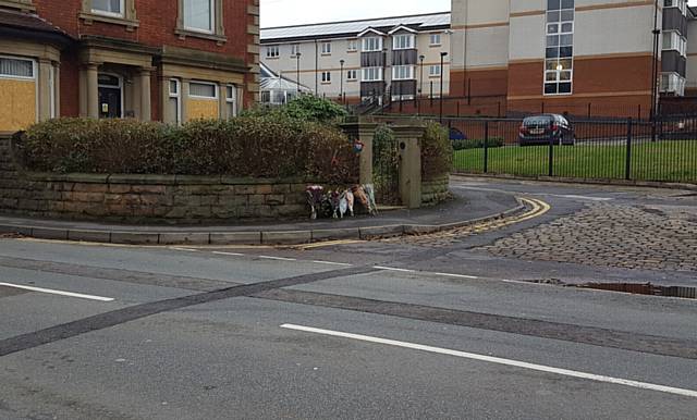 FLOWERS and tributes have been left at the scene of the incident in Sandy Lane 