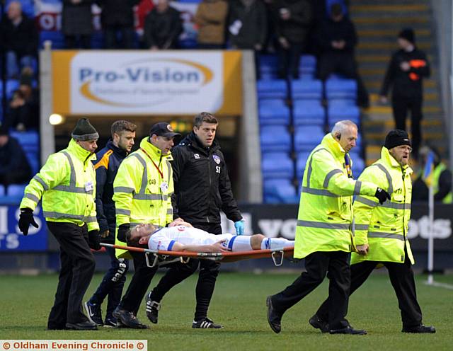 CONCERN: Cameron Dummigan leaves the field on a stretcher