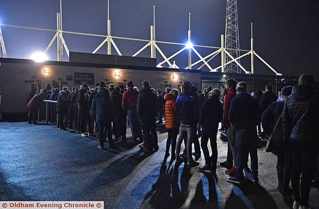 FANS queue to enter the ground