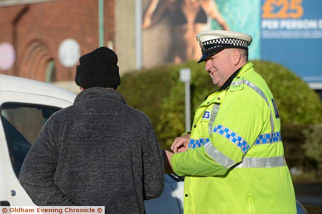 LITTLE chat . . . an officer has a word with a driver