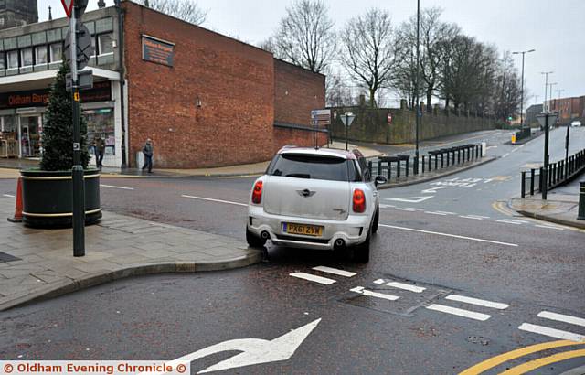 OOPS . . . this driver clips the kerb while turning the wrong way