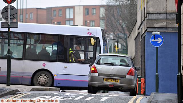 NO left turn . . . but this driver ignores the signs
