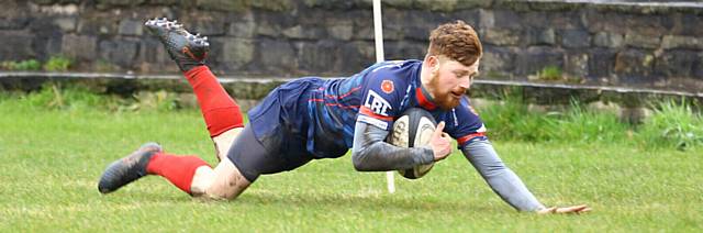 SLIDING HOME...Alex Jobson goes over for Oldham.


