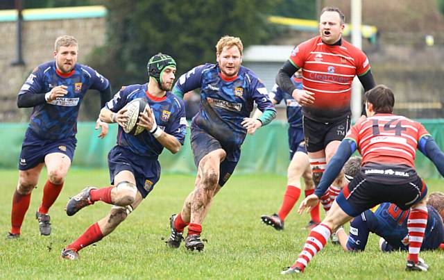 BREAKING OUT...Jack Taylor looks for a gap in the Bolton line 
