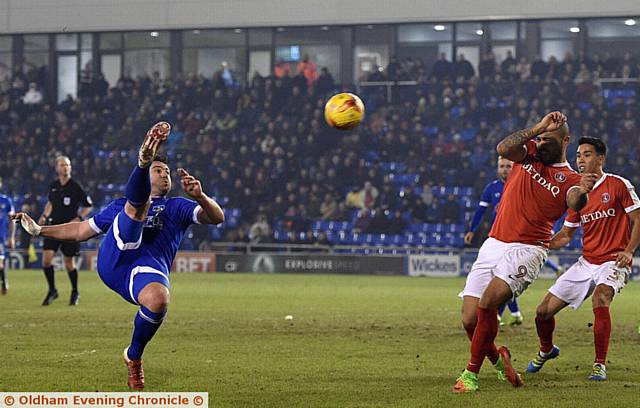 ATHLETIC defender Anthony Gerrard hooks the ball into the danger area