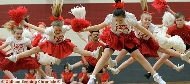 LEAPING in the air. . . .  the Knowsley School team