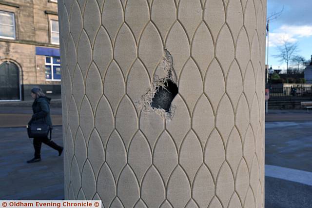 HOLE . . . A hole appeared in the owl column in Parliament Square caused by construction work in the area