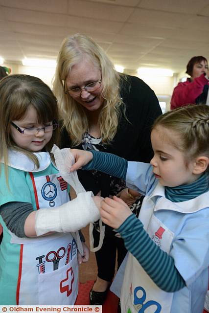 First aid session for Oldham Professional Childminders and their charges at Holy Family Church, Failsworth. Left to right, Ruby Widdup (4), childminder Angie Ainsworth, Evie Barrow (3).
