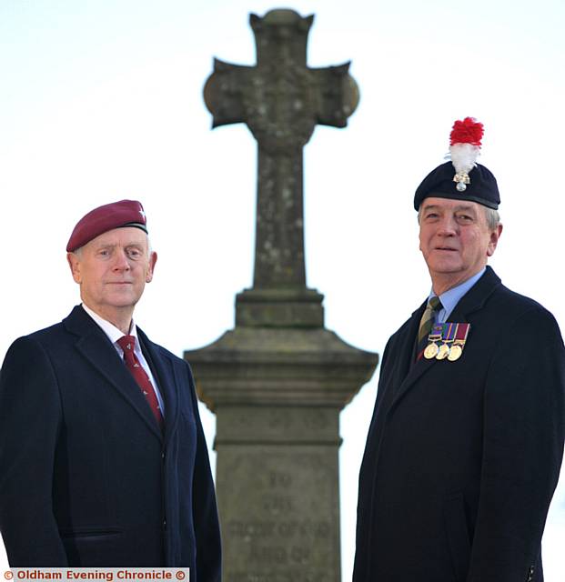 PROUD . . . Trevor Warren (left) and Alan Noble pictured at the war memorial at Oldham Parish Church