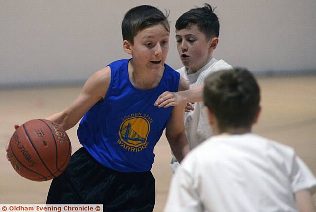 LOOKING FOR A GAP: Radclyffe's Cameron Hyde (Radclyffe) with the ball against Blue Coat