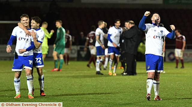 GET IN . . . Athletic players celebrate in front of the away fans at the final whistle