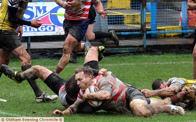 ON THE SLIDE . . . Full-back Richard Lepori goes over for Oldham