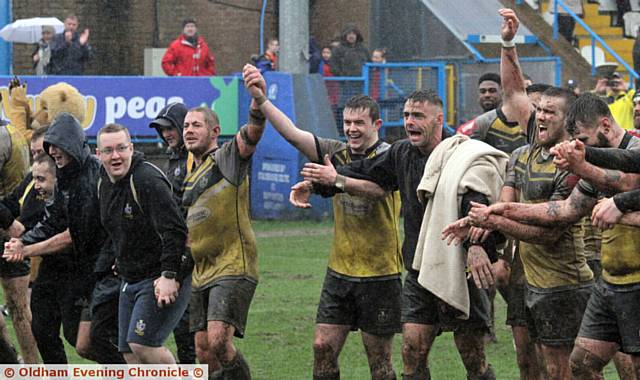 PLAUDITS . . . The amateurs of Haydock salute supporters after a gutsy effort in poor conditions