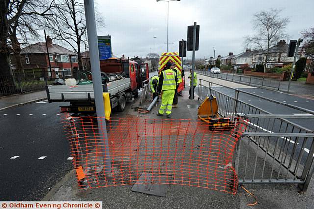 Crash site on Broadway, Chadderton where driver died in RTA. PIC shows workmen making repairs to traffic lights.