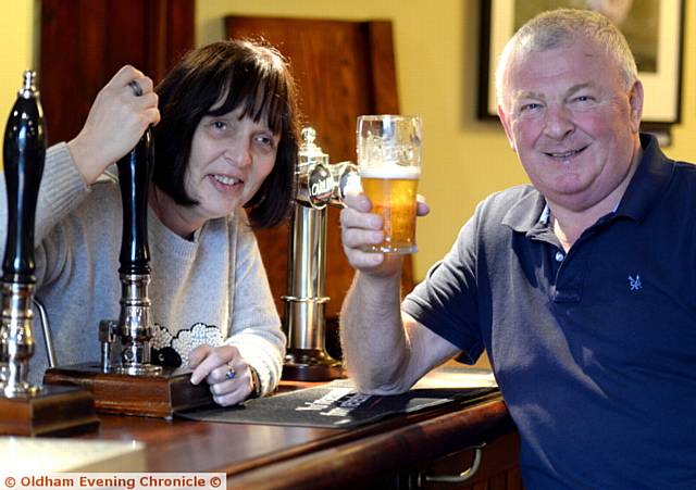 RAISING a glass . . . Heather Casson and Peter Archer