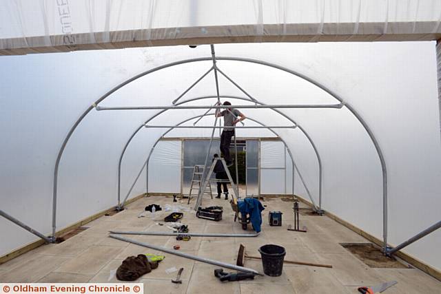 Large poly tunnel being constructed in Dunwood Park, outside bungalows in Parkside Avenue, Shaw.