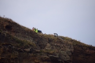 A DAD whose quick-thinking actions helped prevent a potentially fatal disaster after a car was left on a 100ft cliff edge in Whitby has been presented with an award for his bravery.Graham Smith Scott, from Oldham, sprung into action when he saw that a car had driven over the edge of a cliff and was dangerously perched on a ledge just metres from dropping onto families on the beach below. Saltwick Bay, Whitby October 26 2016
