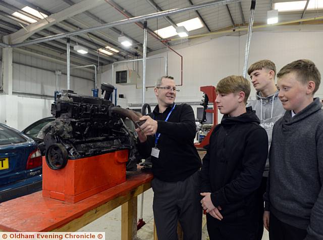 MOTOR vehicle lecturer Ricky Hume with prospective students left to right, Mason Grisdale-Davies, Jedrzej Nowak, and Connor Capper.