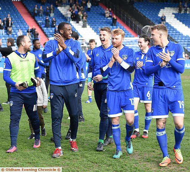 THANKS FOR YOUR SUPPORT . . . Athletic players show their appreciation to the fans on a lap of the pitch.