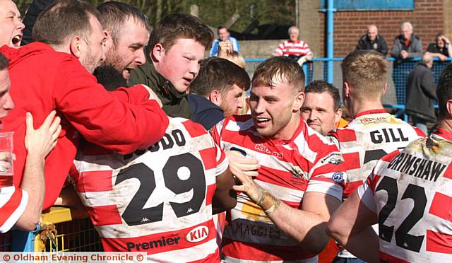 CELEBRATIONS . . . Players and supporters savour the victory