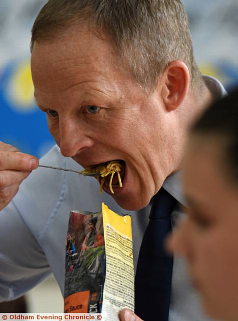 Children at St Joseph's RC primary school in Shaw testing expedition food with teacher Steve Hill. Mr Hill is off to the jungle to take part in a charity endurance run. PIC shows Steve Hill.
