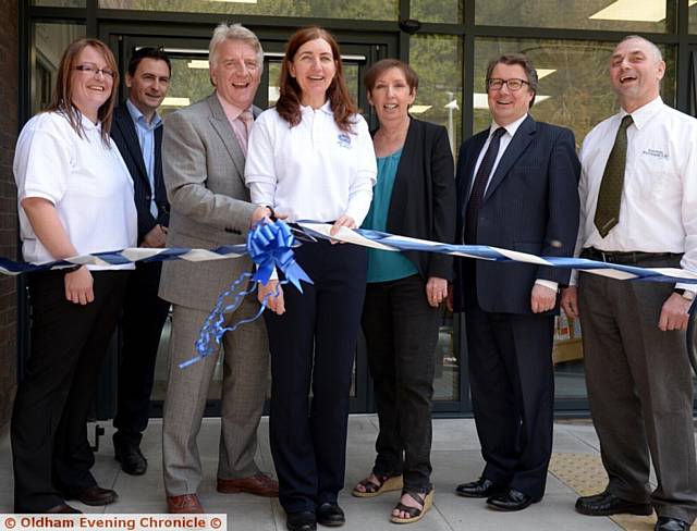 OPEN . . . Cutting the ribbon are (from left) animal centre manager Vikki Walsh, architect David Whitele, RSPCA chief executive Jeremy Cooper, operations director Denise McCabe, Trustees chairman Angela Garvi, surveyor John Thomson, John Woolley site manager from Emanuel Whittaker Ltd
