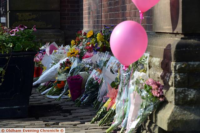 RESPECT . . . flowers and pink balloons have been placed outside Royton Town Hall